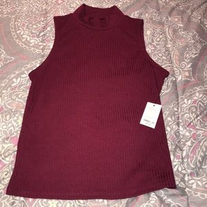 Sleeveless ribbed mock neck shirt